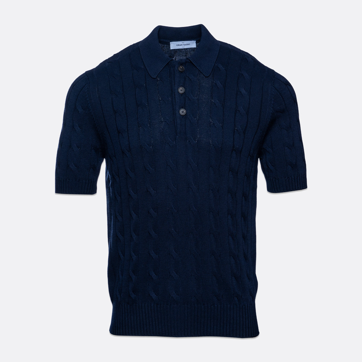 A dark navy blue short-sleeve knit polo shirt with a cable pattern, shown against a light grey background. Gran Sasso Polo available at Sakks Menswear in Southampton.