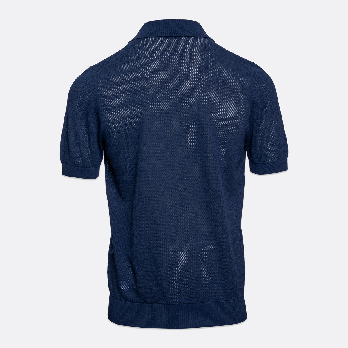 A navy blue short-sleeve knit polo shirt shown from the back, featuring a textured open-knit pattern and ribbed collar, cuffs, and hem, set against a plain light gray background. Gran Sasso Polo available at Sakks Menswear in Southampton.