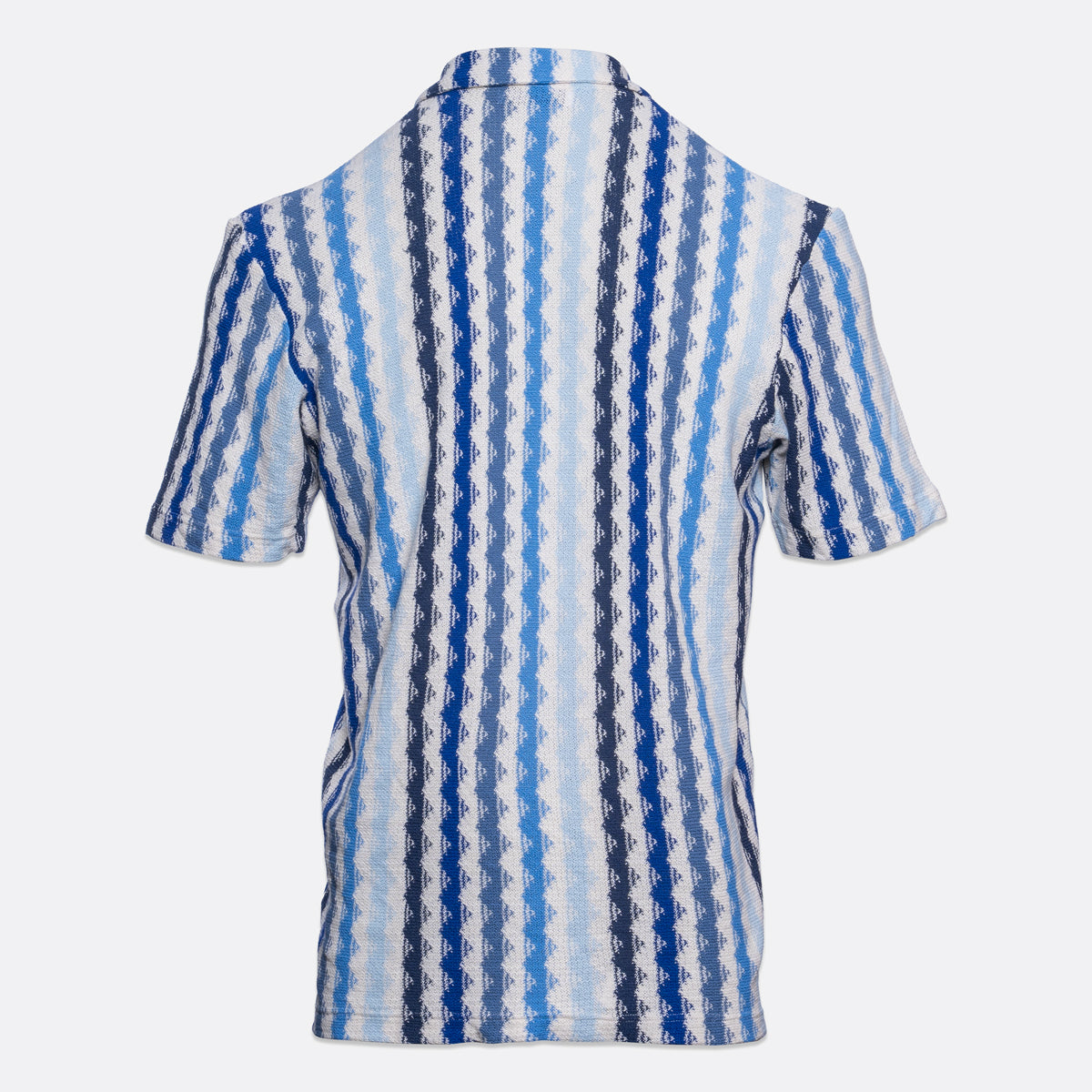 A short-sleeve collared shirt shown from the back, featuring a vertical wavy stripe pattern in shades of blue, navy, and white. Gran Sasso Short Sleeve Shirt available at Sakks Menswear in Southampton.