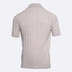 A short-sleeve knit polo shirt shown from the back, featuring vertical ribbed texture and a classic collar, in a light taupe-beige colour on a plain light grey background. Gran Sasso Polo available at Sakks Menswear in Southampton.