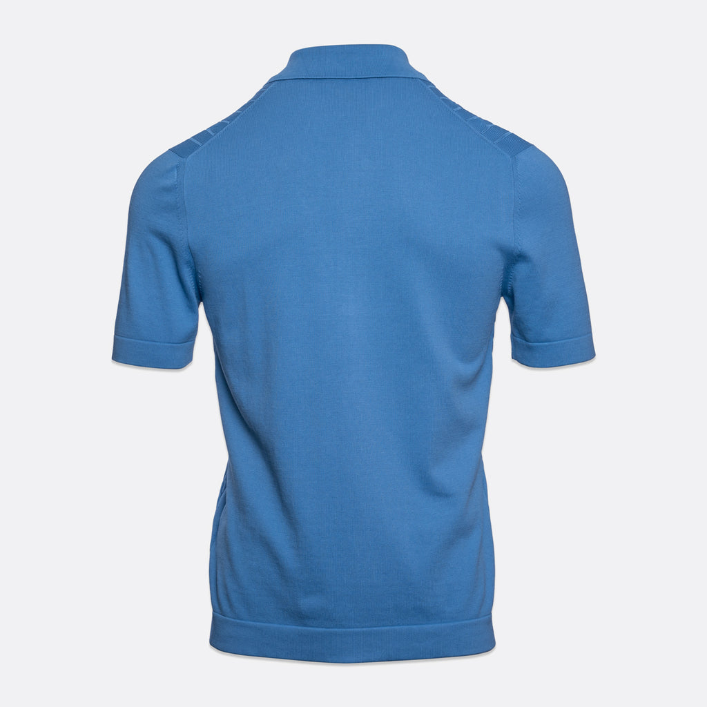 A blue short-sleeve polo shirt shown from the back, displayed on a clean, light gey background. Gran Sasso Polo available at Sakks Menswear in Southampton.