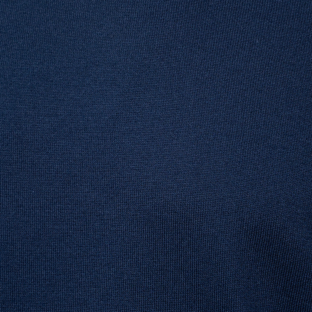 A close-up of dark navy blue knit fabric texture. Gran Sasso T-Shirt available at Sakks Menswear in Southampton.
