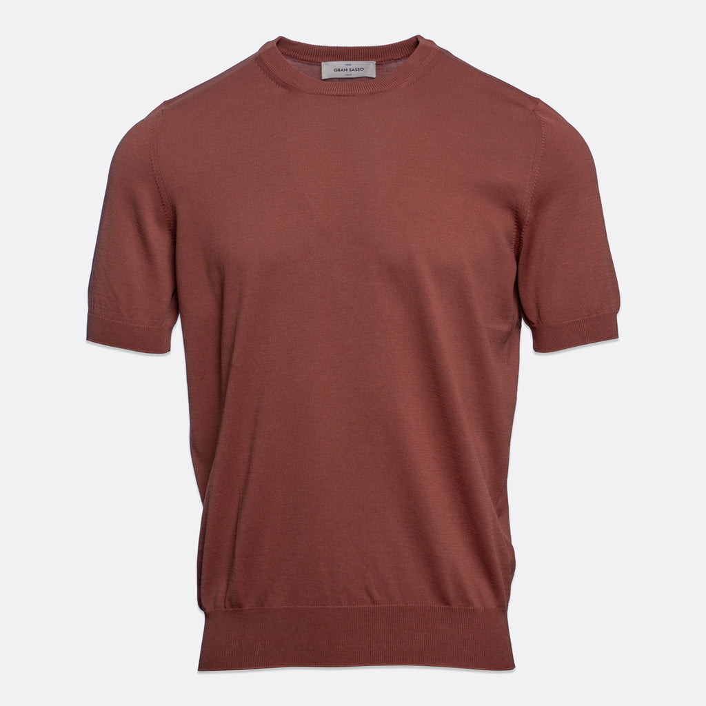 A short-sleeve crewneck knit sweater in a muted terracotta or rust colour, displayed on a clean, light grey background. Gran Sasso T-Shirt available at Sakks Menswear in Southampton.