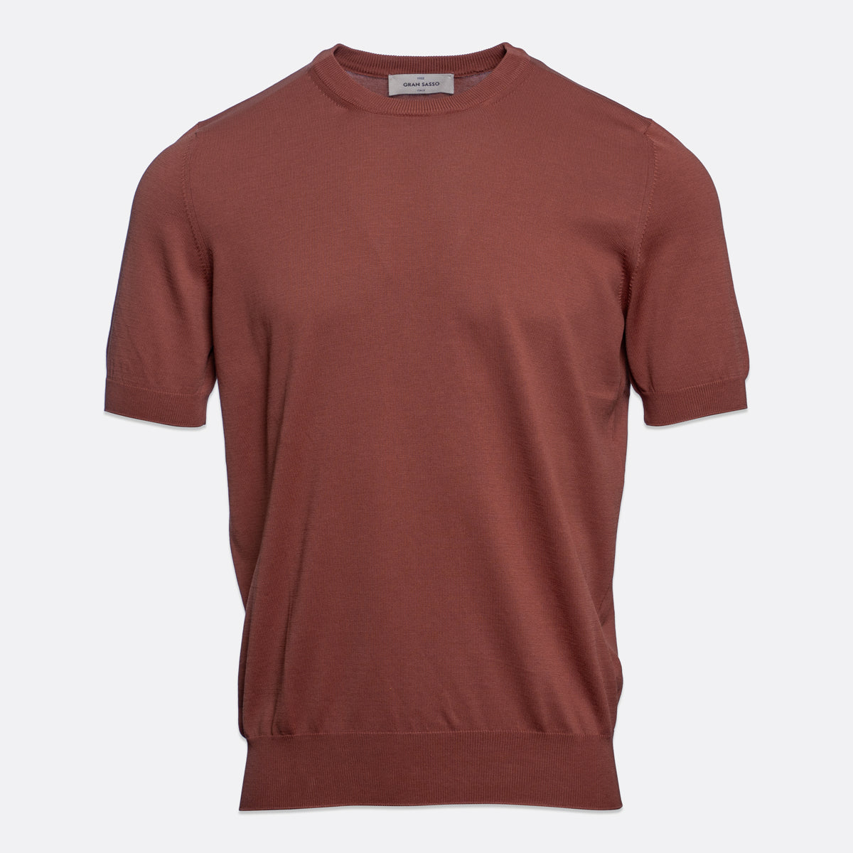 A short-sleeve crewneck knit sweater in a muted terracotta or rust colour, displayed on a clean, light grey background. Gran Sasso T-Shirt available at Sakks Menswear in Southampton.