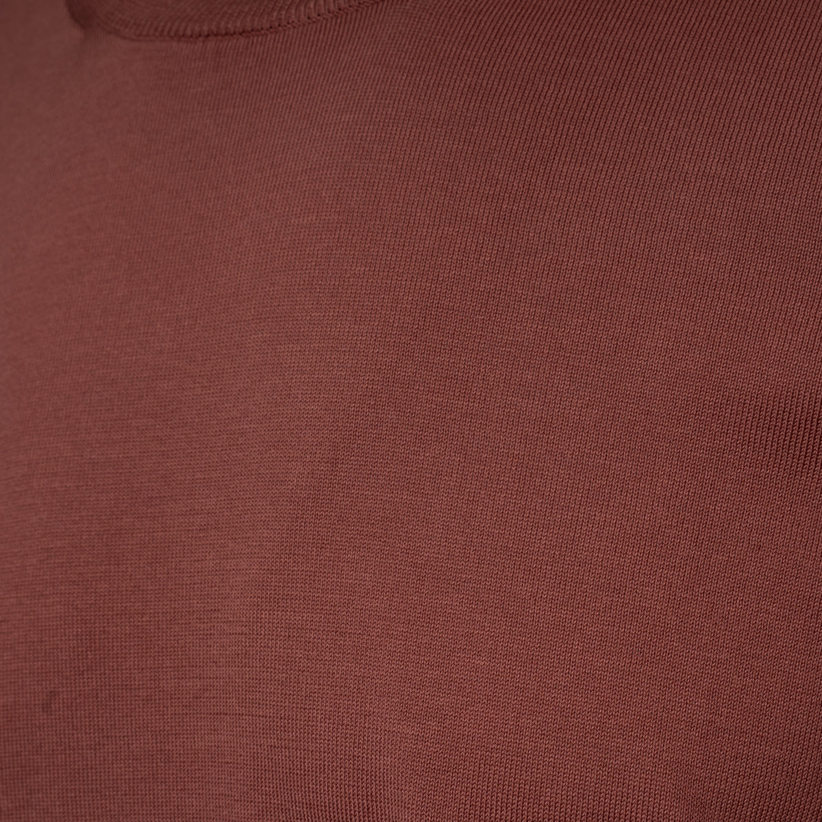 Close-up of a ribbed knit fabric in a muted dusty rose or mauve colour. Gran Sasso T-Shirt available at Sakks Menswear in Southampton.