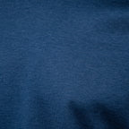 A close-up of dark blue heathered fabric texture filling the frame. Gran Sasso T-Shirt available at Sakks Menswear in Southampton.