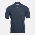 A short-sleeve polo shirt in a dark slate blue colour, displayed on a clean, light grey background. Gran Sasso Polo available at Sakks Menswear in Southampton.