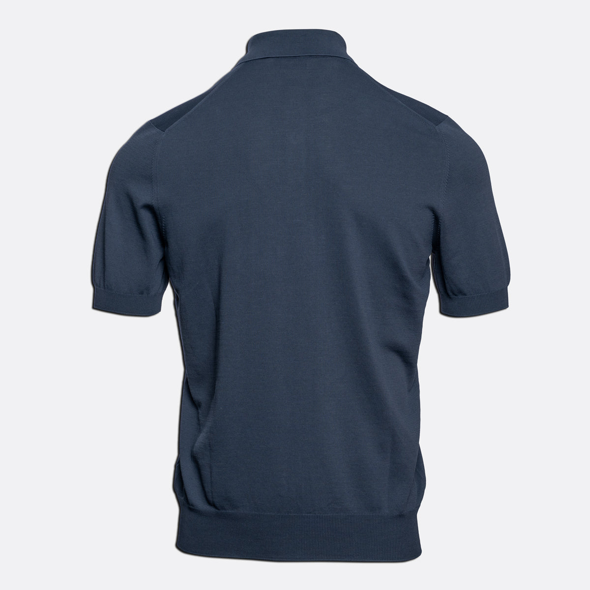 A grey short-sleeve knit polo shirt shown from the back, displayed on a clean, light gray background. Gran Sasso Polo available at Sakks Menswear in Southampton.