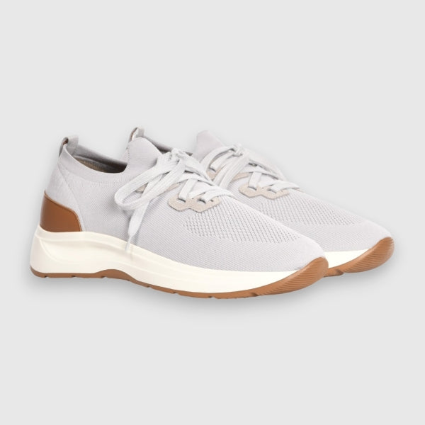 Light grey sneakers with white soles and brown soles on a light grey background. Gran Sasso Sneakers available at Sakks Menswear in Southampton.