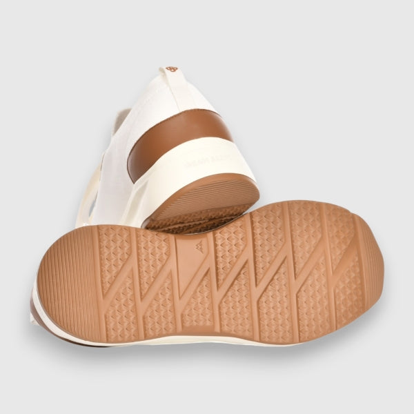 White and brown shoe with textured sole on a light grey background. Gran Sasso Sneakers available at Sakks Menswear in Southampton.