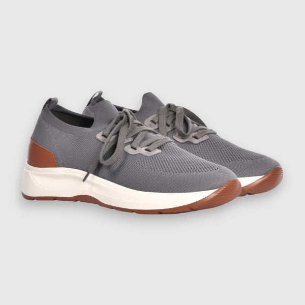 Grey sneakers with brown accents on a light grey background. Gran Sasso Sneakers available at Sakks Menswear in Southampton.