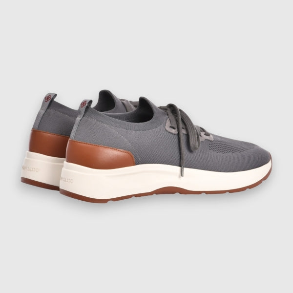 Pair of grey sneakers with brown soles on a light grey background. Gran Sasso Sneakers available at Sakks Menswear in Southampton.