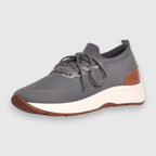 A grey knit slip-on sneaker with a thick white midsole and brown outsole, shown from a side profile on a light grey background. Gran Sasso Sneakers available at Sakks Menswear in Southampton.