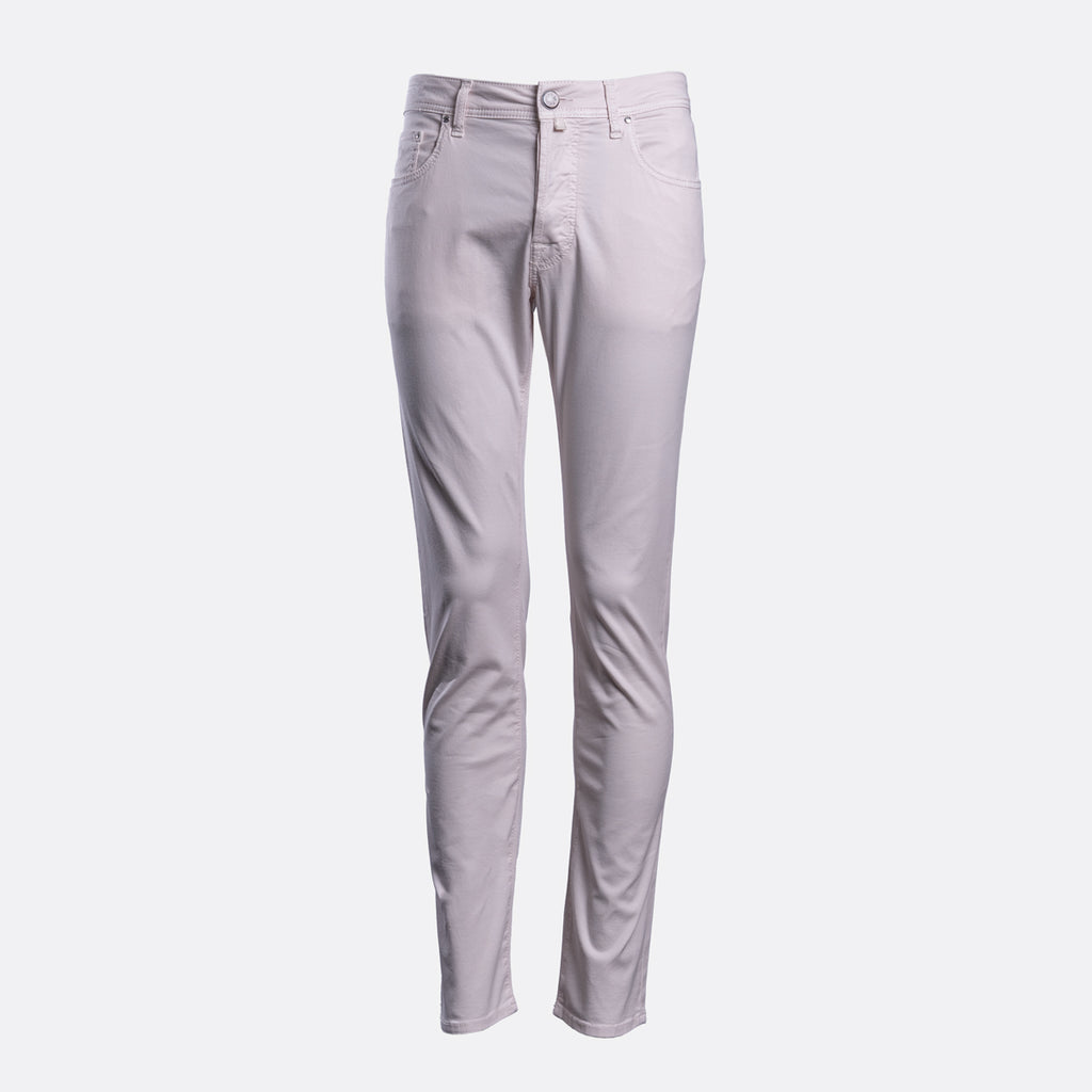 A pair of slim-fit jeans in a light lavender-gray color, shown flat against a solid light gray background. Jacob Cohën Chinos available at Sakks Menswear in Southampton.
