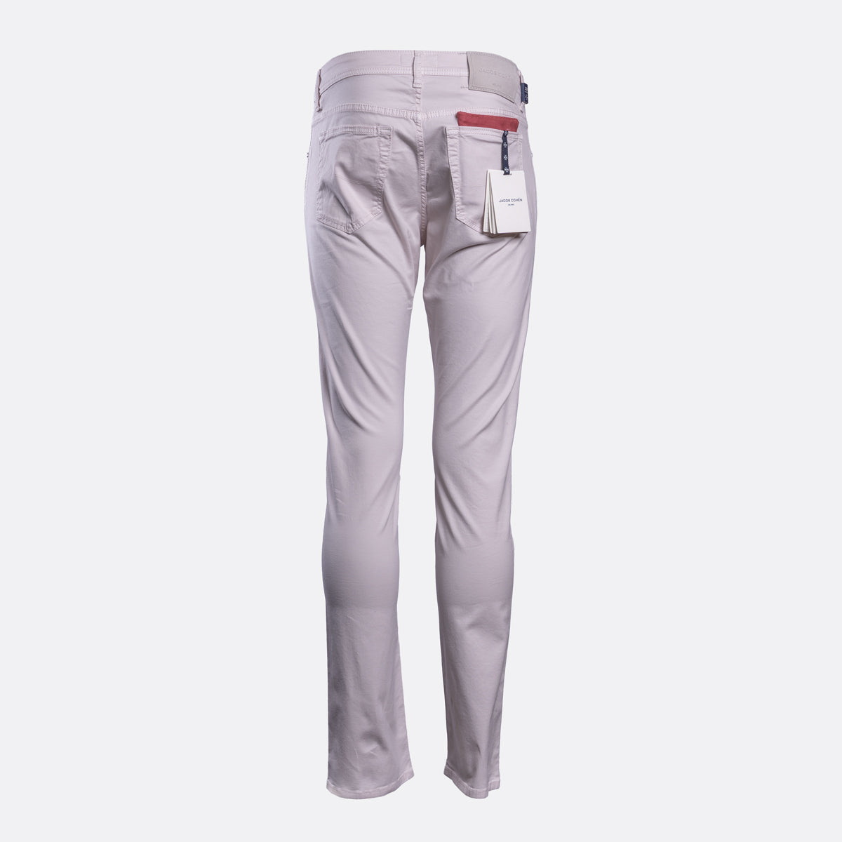 A pair of light gray slim-fit trousers shown from the back, featuring a white paper tag in the back pocket and a red accent tab on the waistband, set against a plain light gray background. Jacob Cohën Chinos available at Sakks Menswear in Southampton.