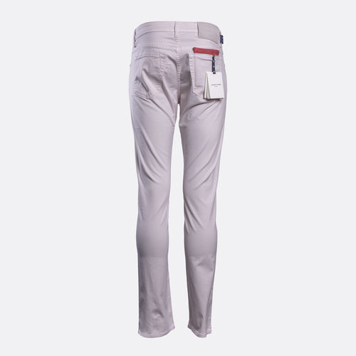 A pair of light gray slim-fit trousers shown from the back, featuring a white paper tag in the back pocket and a red accent tab on the waistband, set against a plain light gray background. Jacob Cohën Chinos available at Sakks Menswear in Southampton.