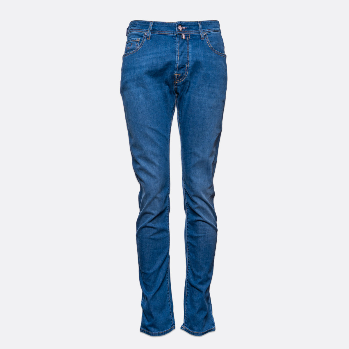 A pair of medium wash blue denim jeans shown on a ghost mannequin against a light gray background. Jacob Cohën Jeans available at Sakks Menswear in Southampton.