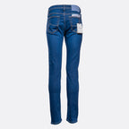 Back view of a pair of medium wash blue jeans with a white brand tag hanging from the back pocket, shown on a light gray background. Jacob Cohën Jeans available at Sakks Menswear in Southampton.