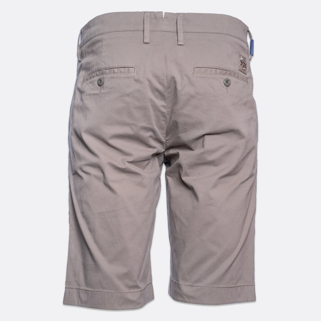 Back view of a pair of men's casual shorts in a light taupe-gray color, featuring belt loops, two buttoned back pockets, and a small brand patch on the upper right side. Jacob Cohën Shorts available at Sakks Menswear in Southampton.
