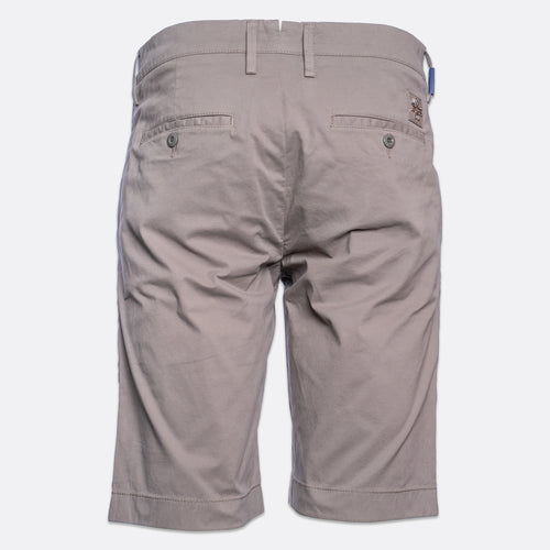 Back view of a pair of men's casual shorts in a light taupe-gray color, featuring belt loops, two buttoned back pockets, and a small brand patch on the upper right side. Jacob Cohën Shorts available at Sakks Menswear in Southampton.