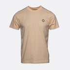 A light beige crewneck t-shirt with a small black geometric diamond logo on the left chest, displayed on a clean light gray background. MA.Strum T-Shirt available at Sakks Menswear in Southampton.
