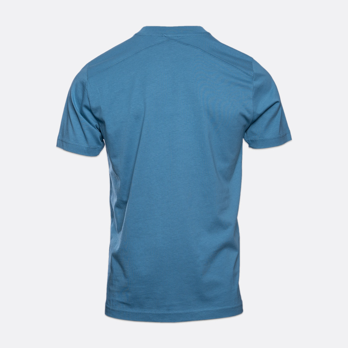 A short-sleeve crewneck t-shirt shown from the back, in a solid medium blue color, displayed on a light gray background. MA.Strum T-Shirts available at Sakks Menswear in Southampton.
