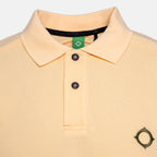 Close-up of a light peach-pink polo shirt with a black collar trim, two black buttons, and a small black geometric logo on the left chest. MA.Strum Polo available at Sakks Menswear in Southampton.