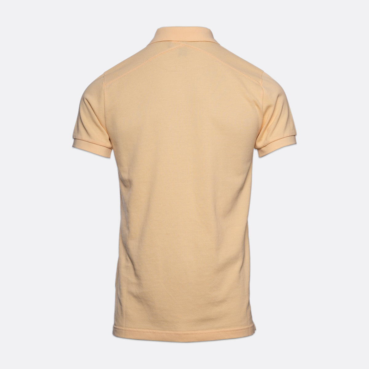 A light beige short-sleeve polo shirt shown from the back, displayed on a clean, light gray background. MA.Strum Polo available at Sakks Menswear in Southampton.