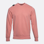 A dusty rose crewneck sweatshirt with a small black and green tag on the left shoulder, displayed on a light gray background. MA.Strum Sweatshirt available at Sakks Menswear in Southampton.