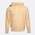 A light peach-colored pullover hoodie with a kangaroo pocket and drawstrings, featuring the Stone Island compass patch on the left shoulder, set against a plain light gray background. MA.Strum Hoodie available at Sakks Menswear in Southampton.