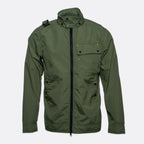 An olive green utility jacket with a high stand-up collar, black front zipper, and flap chest pocket, shown against a light gray background. MA.Strum Jacket available at Sakks Menswear in Southampton.