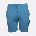 Blue sweat shorts with a drawstring waist and a signature pocket flap on the left leg, shown against a light gray background. MA.Strum Sweat Shorts available at Sakks Menswear in Southampton.