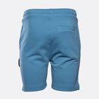 Blue sweat shorts shown from the back, featuring an elastic waistband, side pockets, and a welt pocket on the upper right leg, photographed against a light gray background. MA.Strum Sweat Shorts available at Sakks Menswear in Southampton.