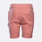 Back view of a pair of dusty pink sweat shorts with a side pocket, shown on a light gray background. MA.Strum Sweat Shorts available at Sakks Menswear in Southampton.