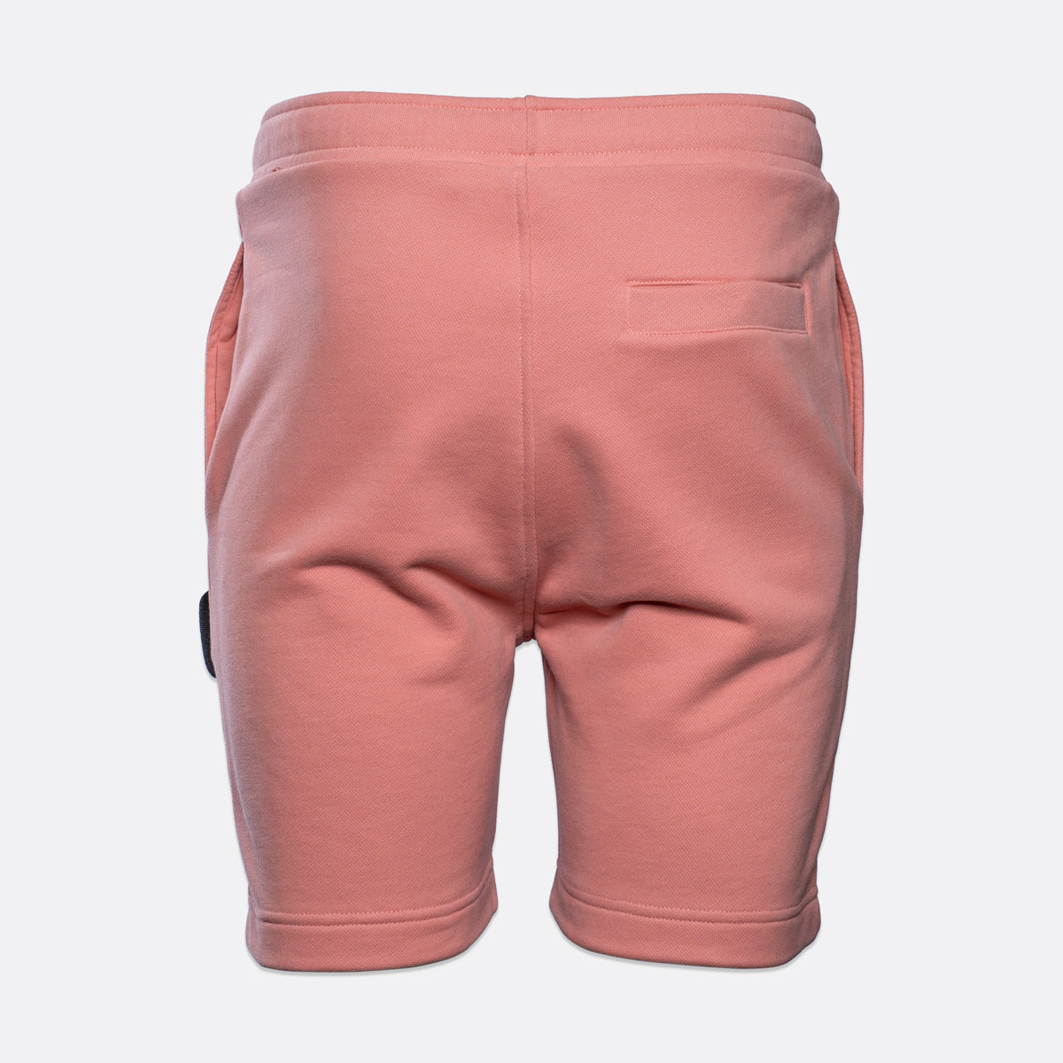 Back view of a pair of dusty pink sweat shorts with a side pocket, shown on a light gray background. MA.Strum Sweat Shorts available at Sakks Menswear in Southampton.