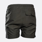 Dark gray cargo shorts shown from the back, featuring an elastic waistband and a buttoned flap pocket on the right side, set against a light gray background. MA.Strum Swimwear available at Sakks Menswear in Southampton.