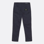 A pair of dark navy blue pants shown from the back, featuring a classic five-pocket design and the iconic Stone Island compass patch on the right back pocket. MA.Strum Jeans available at Sakks Menswear in Southampton.