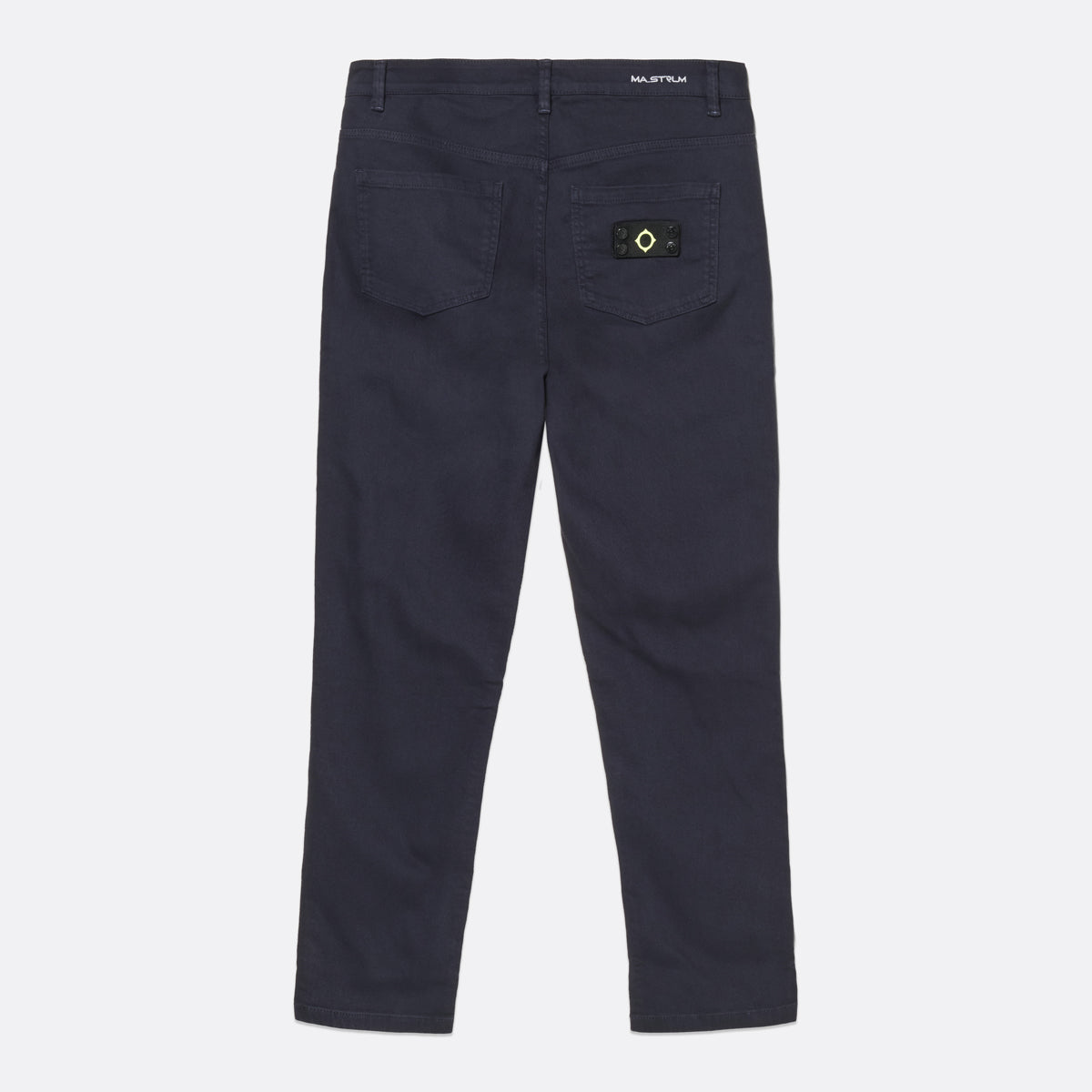 A pair of dark navy blue pants shown from the back, featuring a classic five-pocket design and the iconic Stone Island compass patch on the right back pocket. MA.Strum Jeans available at Sakks Menswear in Southampton.
