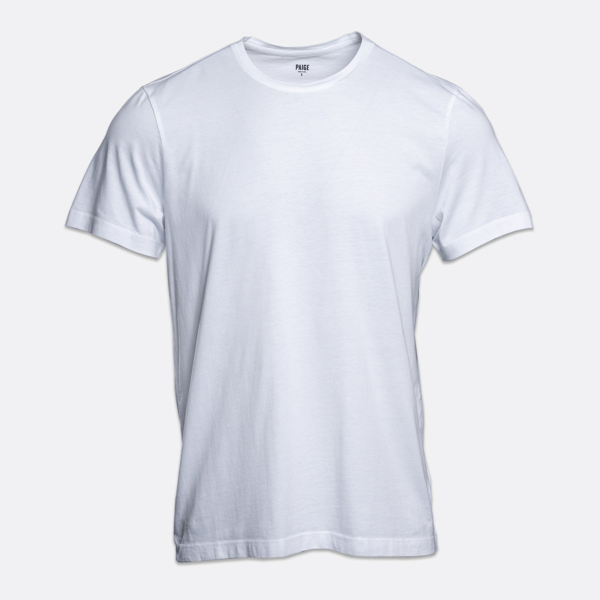 A plain white short-sleeve crewneck t-shirt displayed against a light gray background. PAIGE T-Shirt available at Sakks Menswear in Southampton.