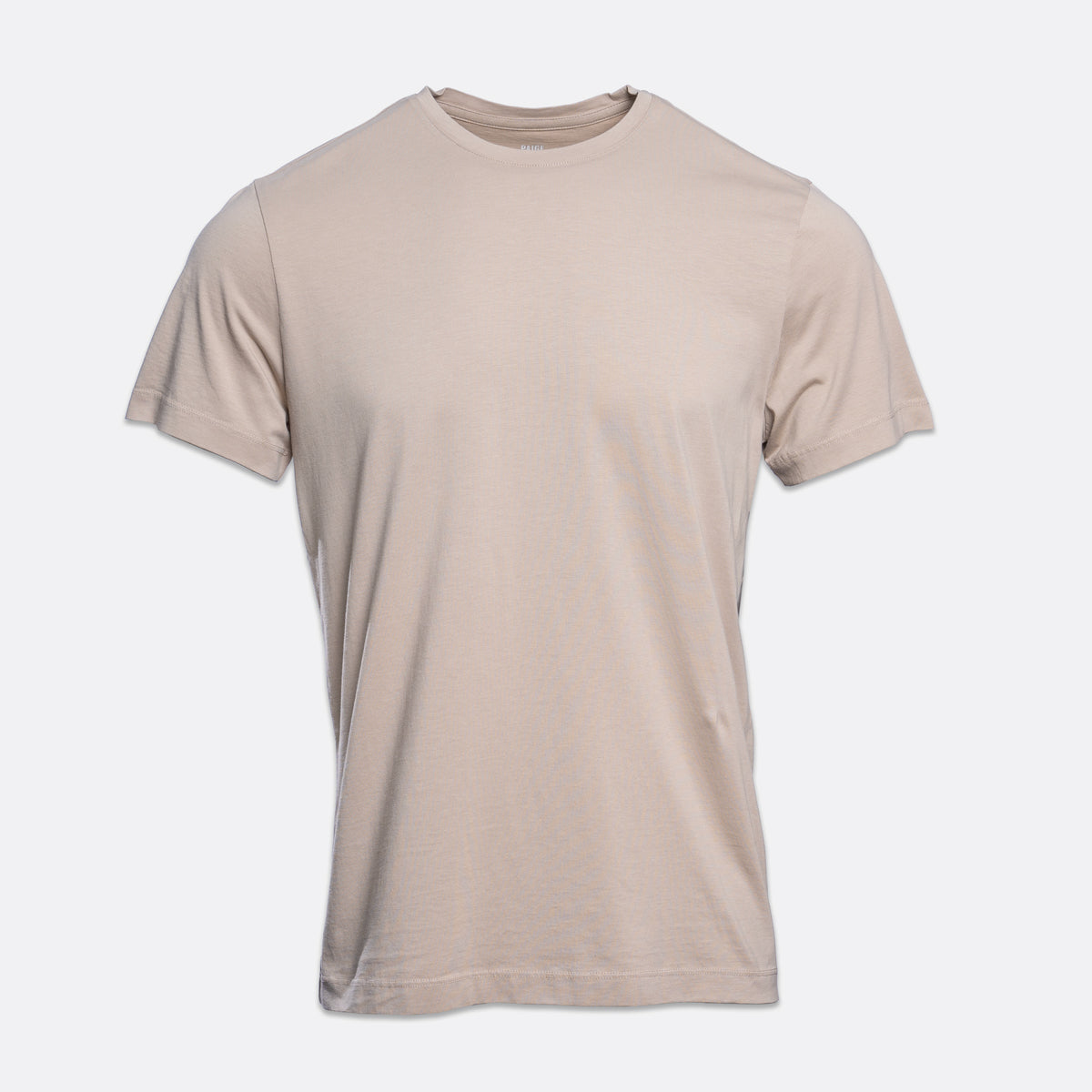 A plain short-sleeve crewneck t-shirt in a light beige or sand color, shown against a light gray background. PAIGE T-Shirt available at Sakks Menswear in Southampton.