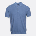 A short-sleeve polo shirt in a textured blue fabric, featuring a two-button placket and white buttons, displayed on a light gray background. PAIGE Polo available at Sakks Menswear in Southampton.