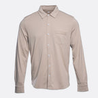 A long-sleeve button-up shirt in a light taupe-beige color, featuring a pointed collar, a single chest pocket, and white buttons, shown against a light gray background. PAIGE Shirt available at Sakks Menswear in Southampton.
