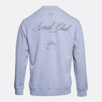 A light heather gray sweatshirt shown from the back, featuring 'Social Club' printed in a black cursive font with 'S.S.'. PAIGE Sweatshirt available at Sakks Menswear in Southampton.