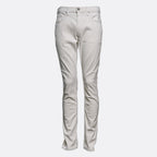 A pair of slim-fit jeans in a light beige or off-white denim wash, shown from the front against a plain light gray background. PAIGE Jeans available at Sakks Menswear in Southampton.