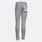 A pair of light gray slim-fit pants shown from the back, featuring a white paper tag attached to the back pocket, set against a plain light gray background. Replay Chinos available at Sakks Menswear in Southampton.