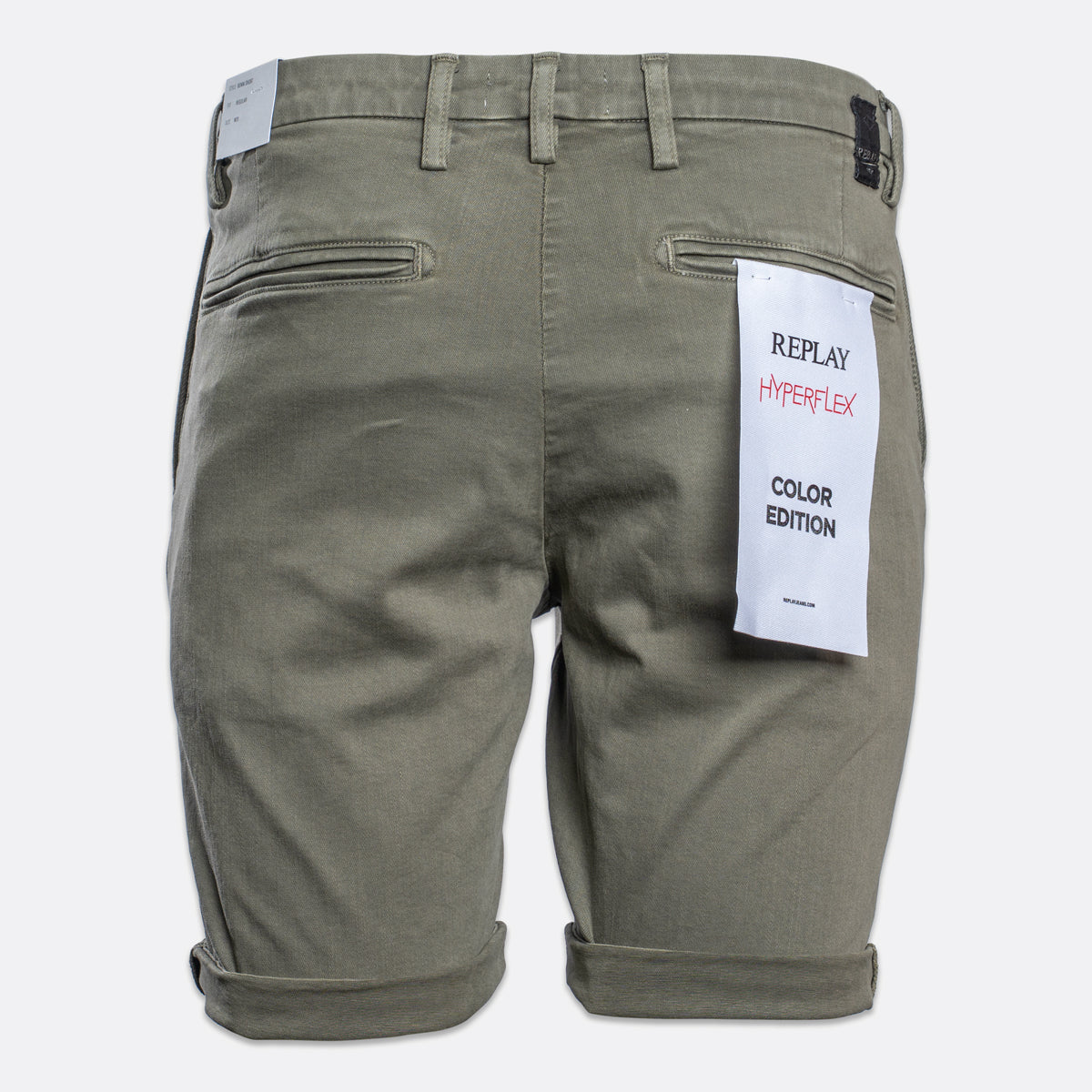 Back view of olive green Replay HyperLex Color Edition shorts with a white product tag attached to the back pocket. Replay Shorts available at Sakks Menswear in Southampton.