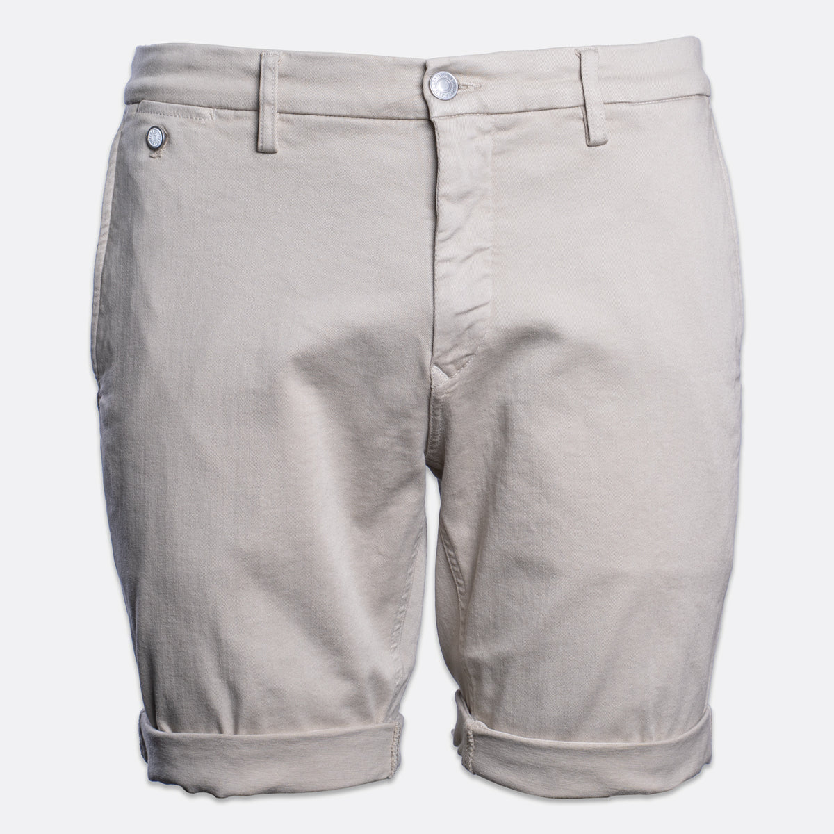 A pair of light beige chino shorts with a button closure and rolled cuffs, shown against a plain light gray background. Replay Shorts available at Sakks Menswear in Southampton.
