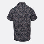 Short-sleeve button-up camp shirt with an all-over dark navy and gray palm leaf pattern, shown from the back on a light gray background. Sand Copenhagen Short Sleeve Shirt available at Sakks Menswear in Southampton.
