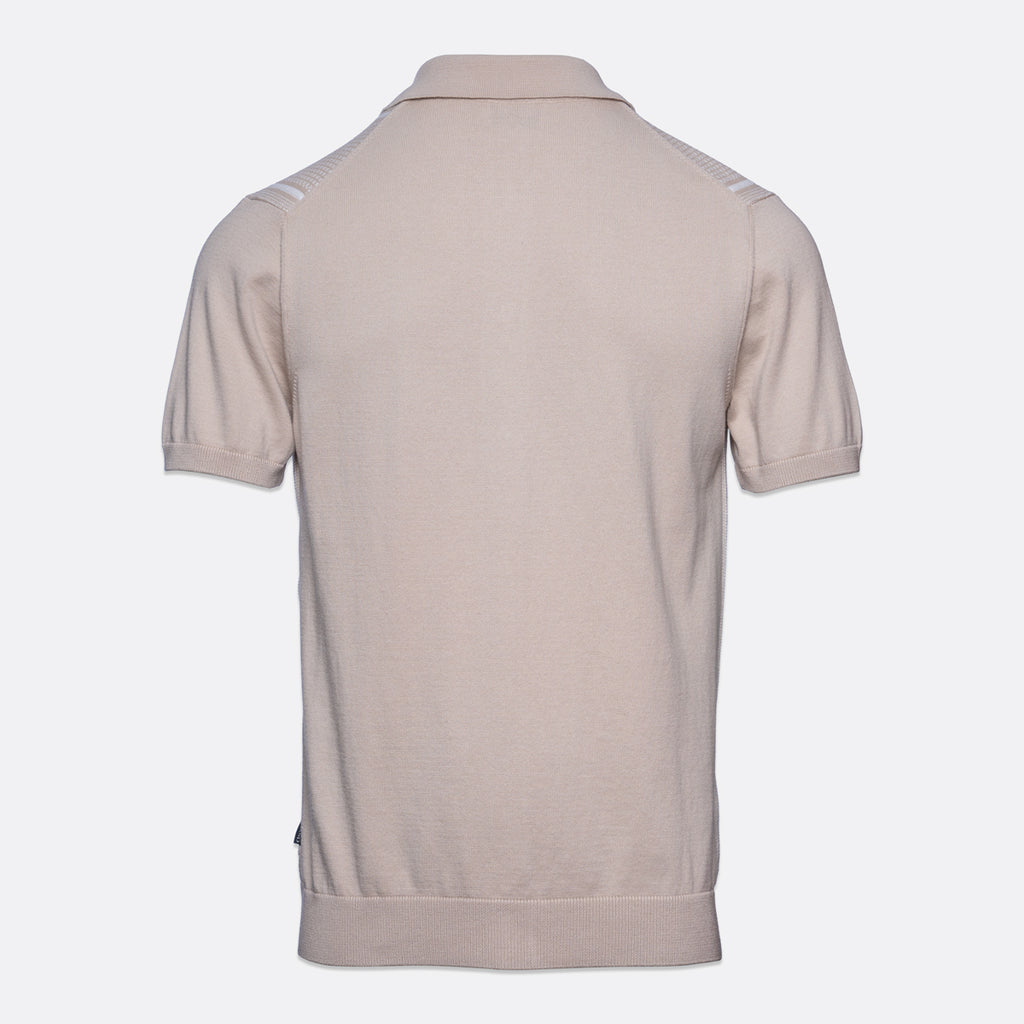A light beige short-sleeve polo shirt shown from the back, featuring subtle white stripe details on the shoulders, set against a plain light gray background. Sand Copenhagen Polo available at Sakks Menswear in Southampton.