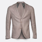 A men's single-breasted blazer in a textured light taupe-beige fabric, featuring notch lapels, two brown buttons, and a subtle woven pattern on the inner lining, shown against a plain white background. Sand Copenhagen Blazers available at Sakks Menswear in Southampton.